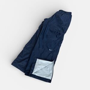 Vintage Y2K Nike wind pants with white embroidered swoosh